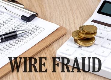 WIRE FRAUD text, calculator, coins, and financial documents, Texas property seizures.