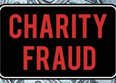 Sign: 'CHARITY FRAUD' on dollars. Post-holiday scam awareness and legal defense.