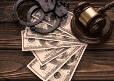 Handcuffs, gavel, dollars: Legal consequences of theft and embezzlement. Understand the difference.