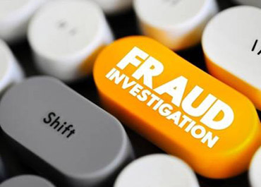 Keyboard key 'FRAUD INVESTIGATION' in orange, representing legal fraud investigation.
