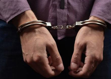 Handcuffed hands. Facing federal prosecution? Explore immunity options.